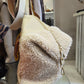 Borsa in pelle e bouclè